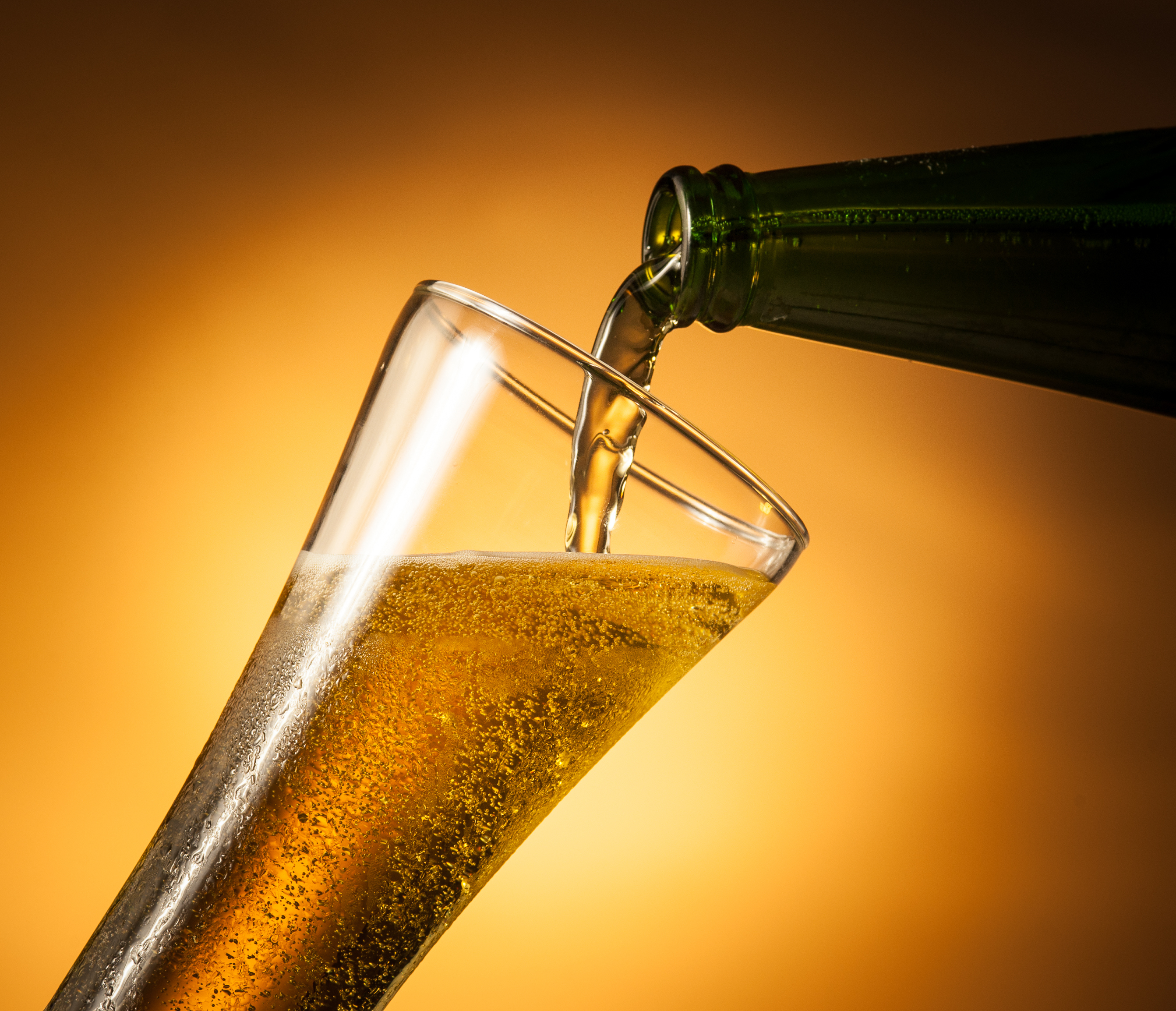 Pouring beer with bubbles